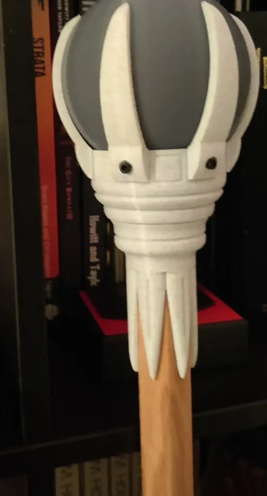 A Crown topper mid-build with a grey placeholder orb