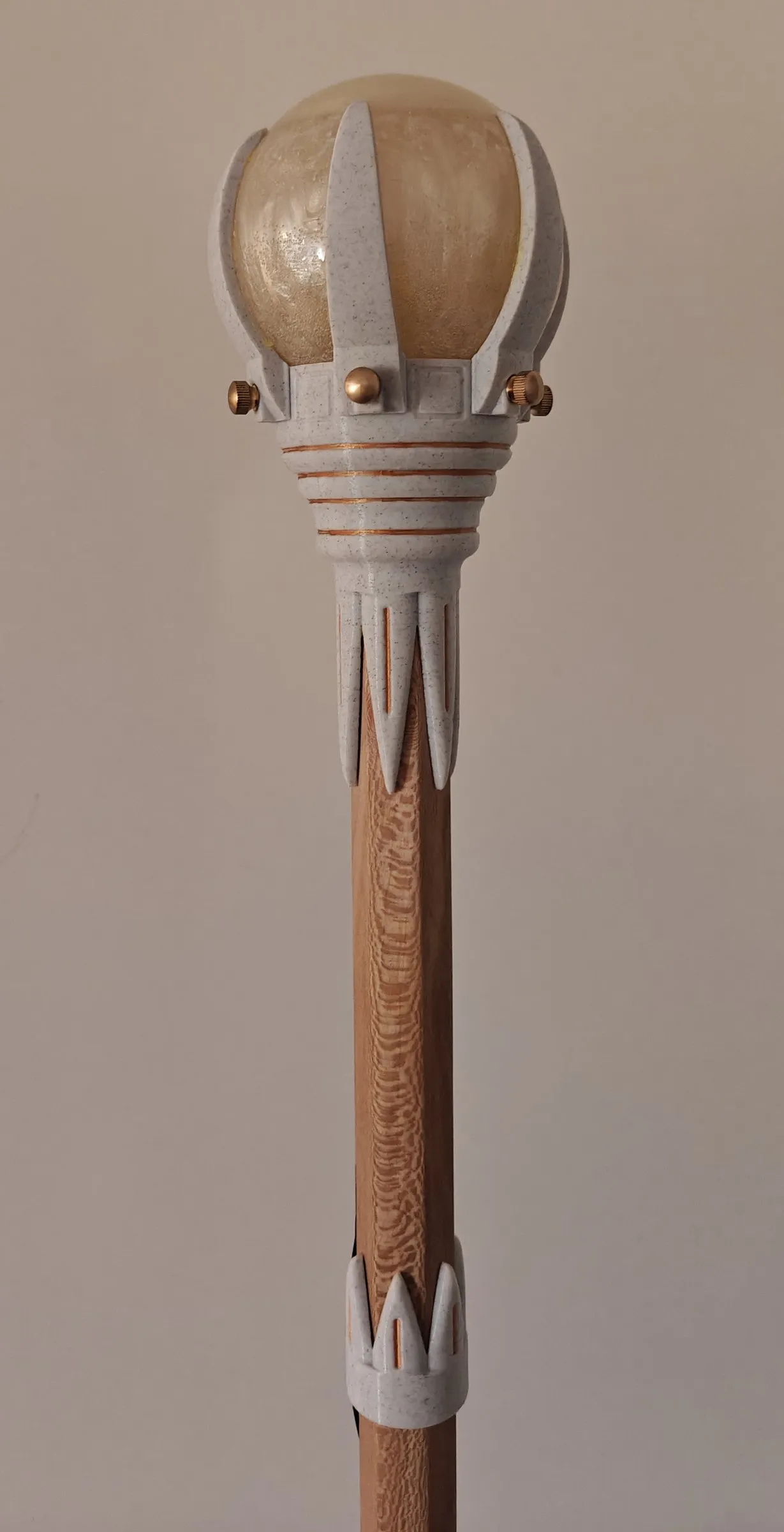 Crown staff with a decorative ring around the wooden shaft