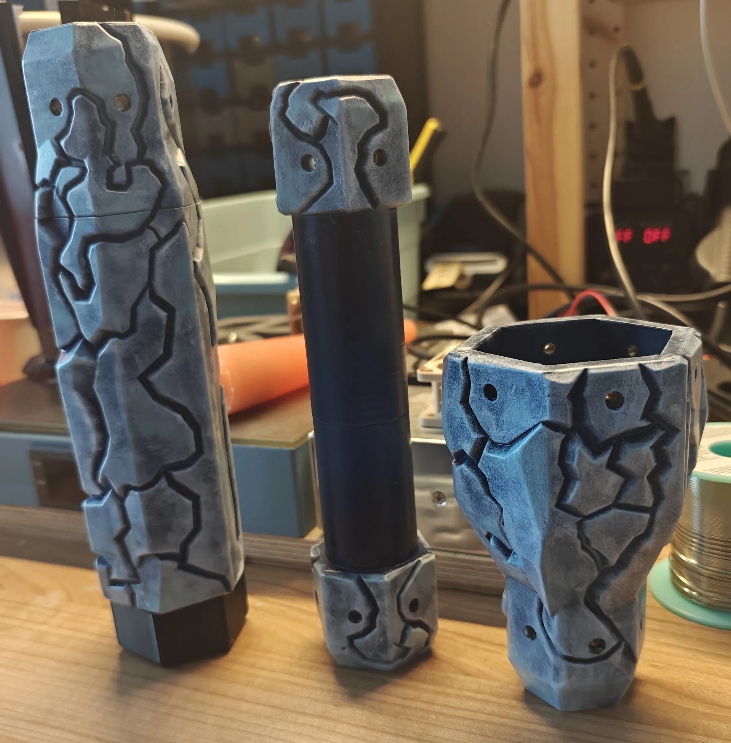 Matching Ice/Rock foot, grip and topper side by side on a workbench