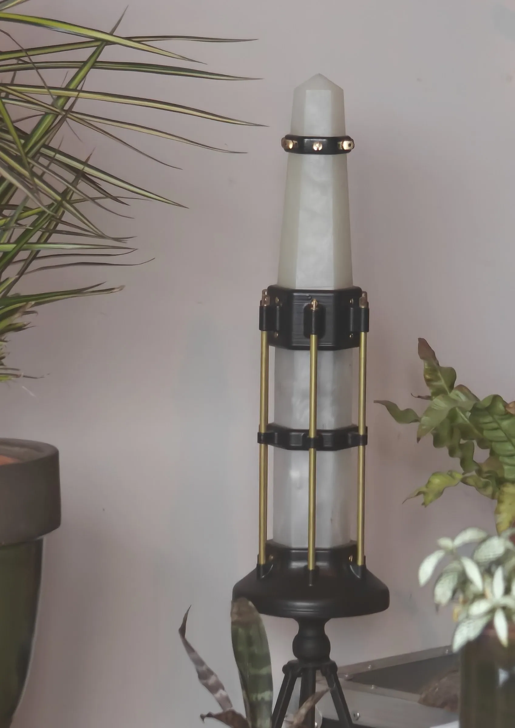 The tall lantern unlit among house plants