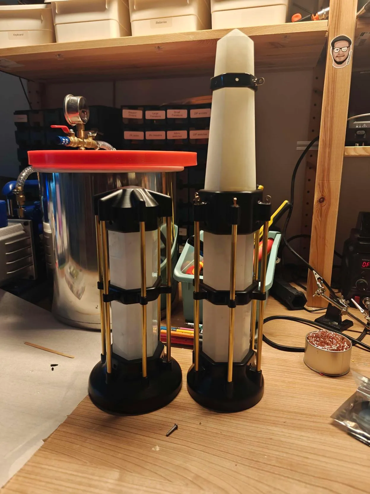 Two lanterns on a cluttered workbench